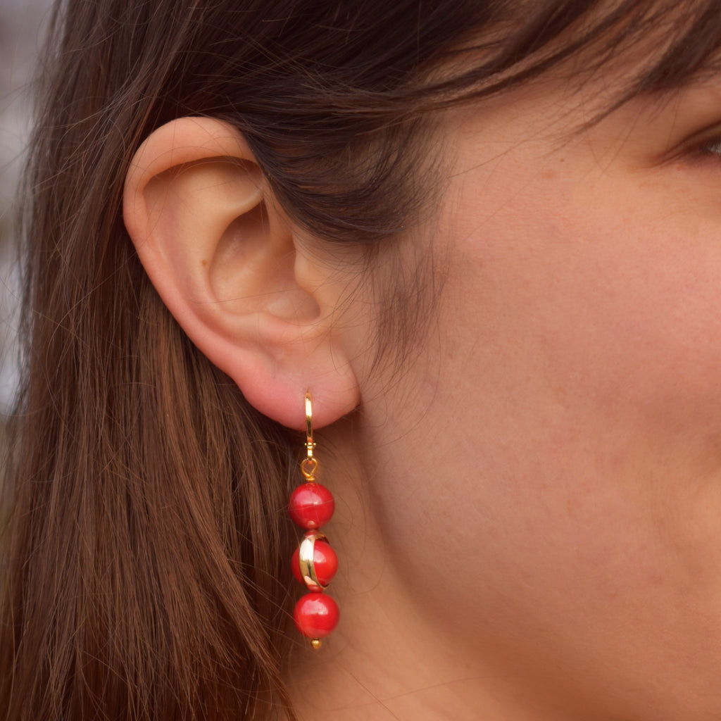 Coral gemstone asymmetric gold huggie earrings | by Ifemi Jewels