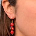 Coral gemstone asymmetric gold huggie earrings | by Ifemi Jewels